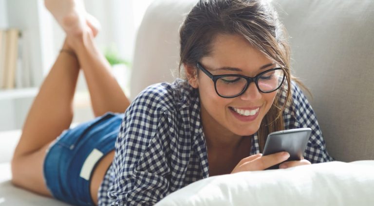 Bespectacled woman, searching "Is STD testing at home accurate?" online.