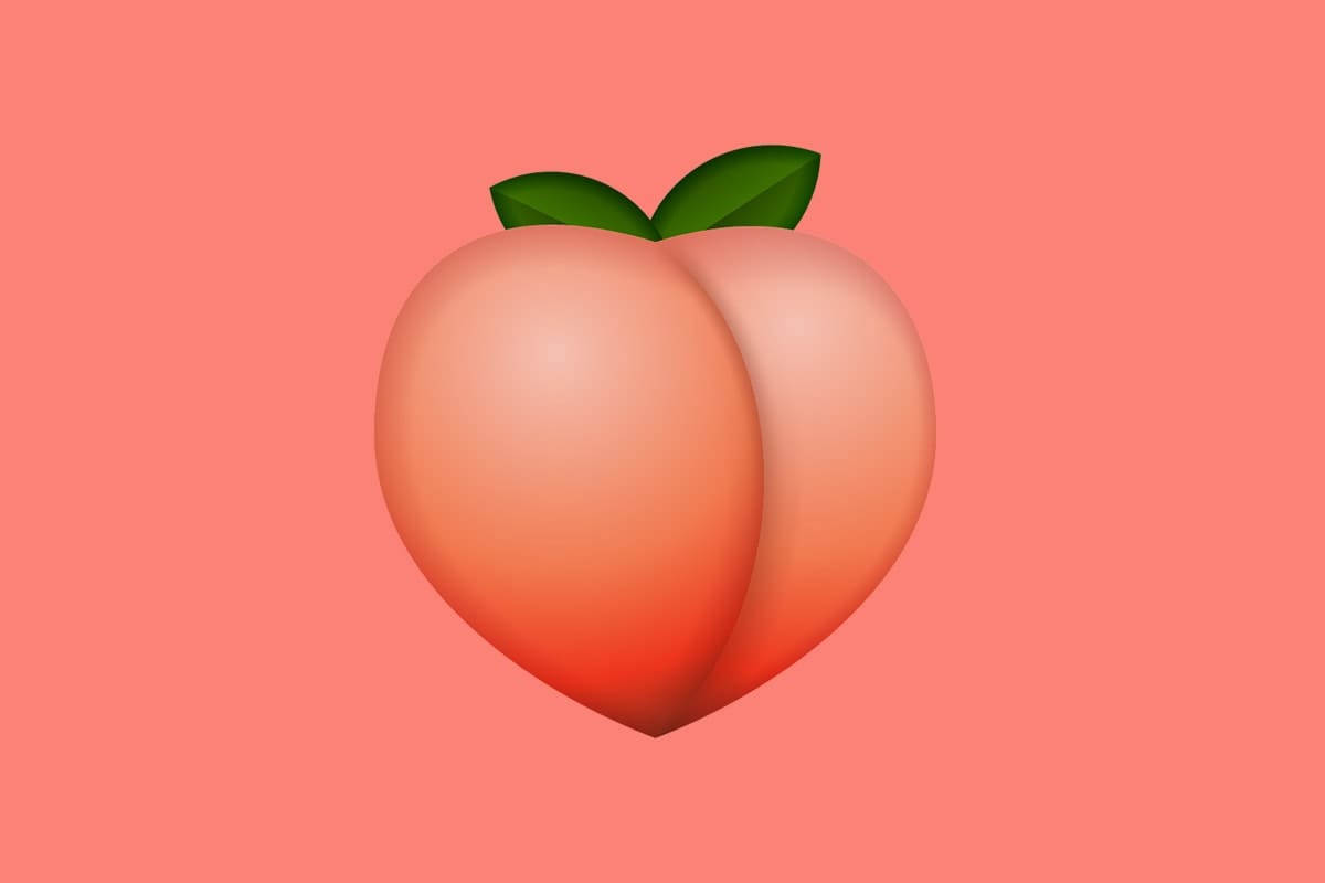 A large peach emoji against a peach-colored background.
