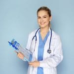 Female doctor with clipboard on color background